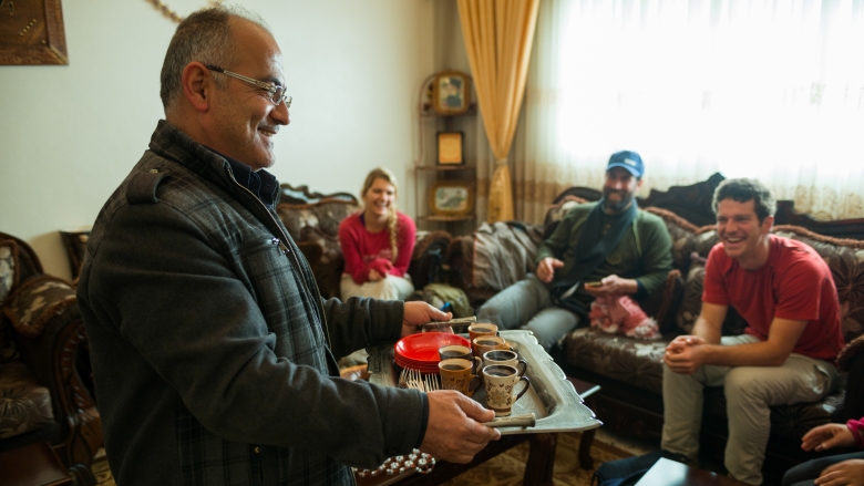 A homeowner in Aqraba welcomes guests. Homestays have popped up along the Abraham Path giving tourists an opportunity to experience Palestinian culture and homeowners the ability to make a living. API/Frits Meyst